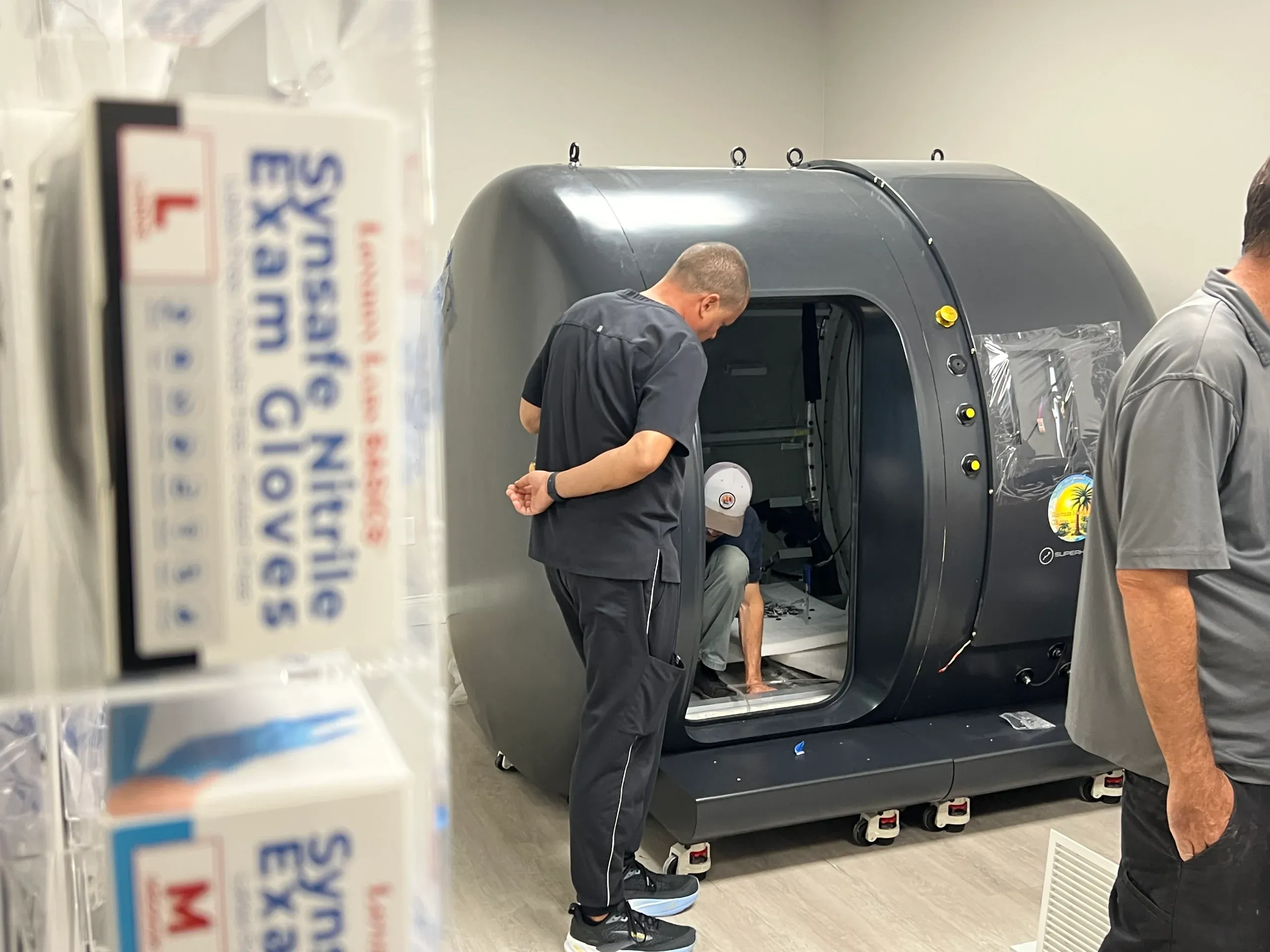 A Superhuman installer configuring a walk-in chamber on site