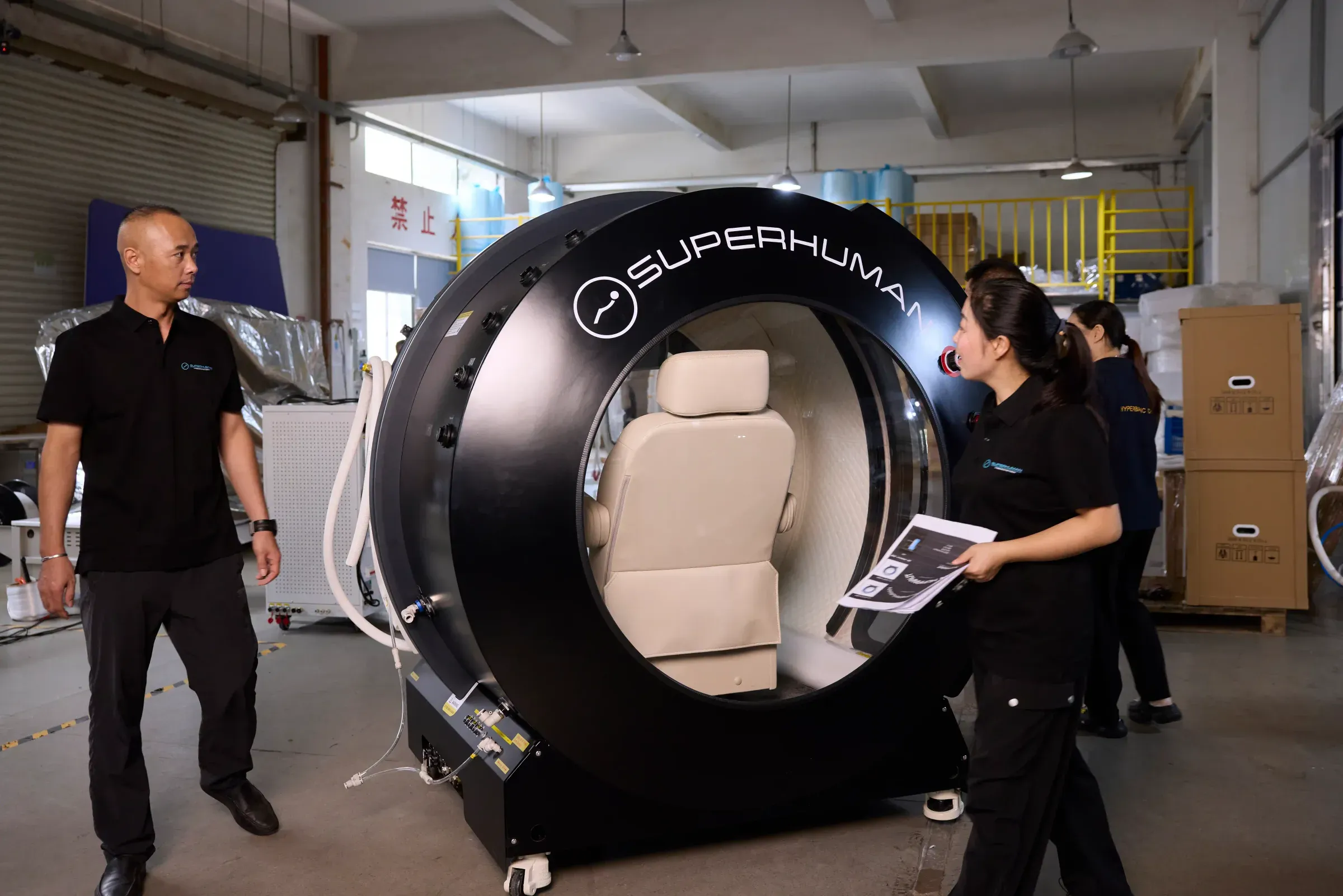 Superhuman team walking a Model X hyperbaric chamber through final assembly